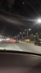 Night driving captured on illuminated Kazan street