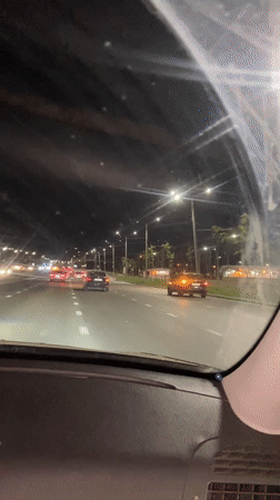 Night driving captured on illuminated Kazan street
