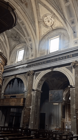 Visitor documents ornate Milan church interior including bone ossuary