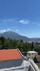 Clear skies over coastal Montenegro city captured in panoramic view