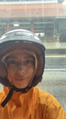 Woman takes rainy day selfie in Abiansemal, Indonesia