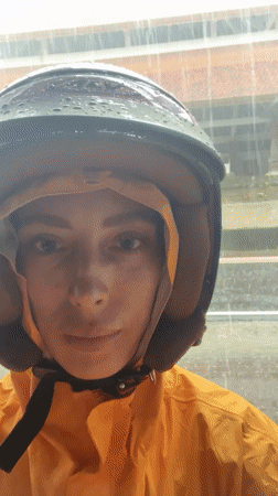 Woman takes rainy day selfie in Abiansemal, Indonesia