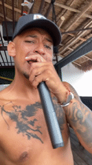 Tattooed man performs at Playa del Carmen bar