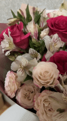 Flower bouquet with roses, alstroemeria documented in Saint Petersburg