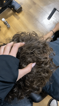 Person exercises on leg press machine at London gym