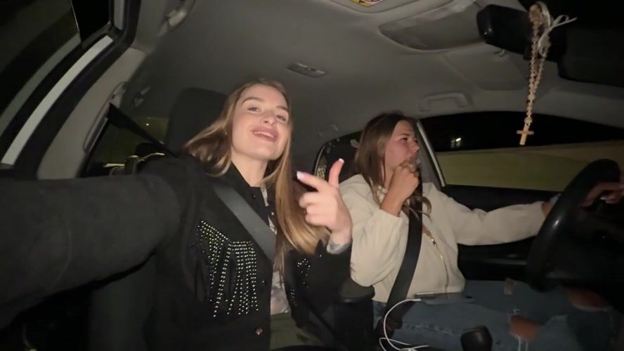 Young women take nighttime car selfies in Montenegro