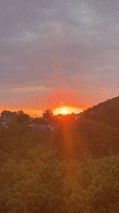 Sunset captured over hillside town of Sosnovy, Russia