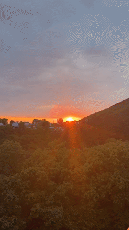Sunset captured over hillside town of Sosnovy, Russia