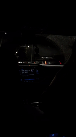 Police lights flash during nighttime traffic stop in Yerevan