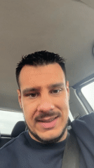Man with mohawk speaks to camera from driver's seat in Sofia