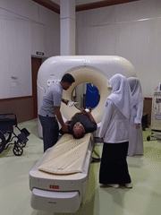 Medical imaging unit in action, with a koi tank oddity