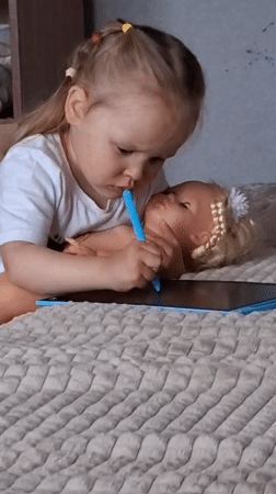Kids playing with toys and tablets in Karsha home