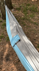 Woman relaxes in hammock, cyclists spotted in Montenegro forest