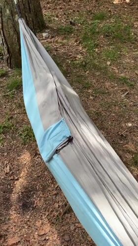 Woman relaxes in hammock, cyclists spotted in Montenegro forest