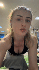Woman documents gym workout session with mirror selfies