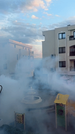 Fogging operation sweeps Plovdiv residential courtyards at sunset