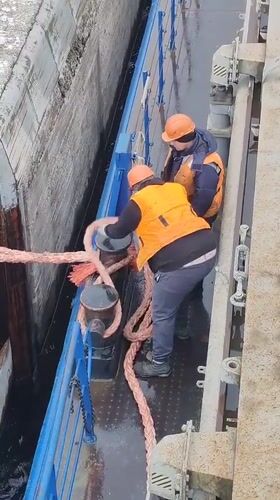 Maritime workers handle equipment on Volga-Baltic Waterway vessel
