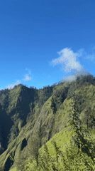 Hikers navigate steep trails amid Kintamani's lush mountain landscapes