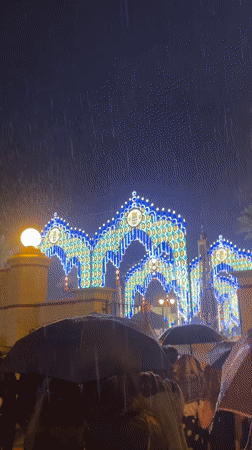 Heavy rain falls on illuminated arches in Jerez, Spain