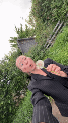 Woman spends afternoon in Chaikovsky, dandelions and car selfies