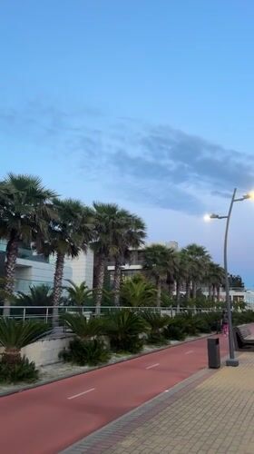 Evening pedestrian stroll captured in modern Sirius district
