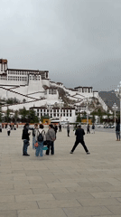 Tourists gather at Potala Palace plaza in Lhasa
