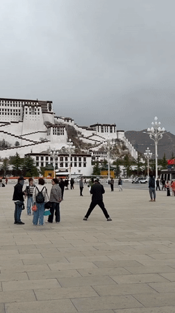 Tourists gather at Potala Palace plaza in Lhasa