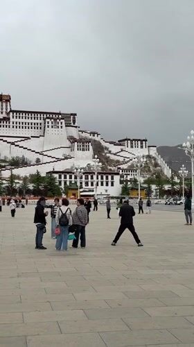 Tourists gather at Potala Palace plaza in Lhasa