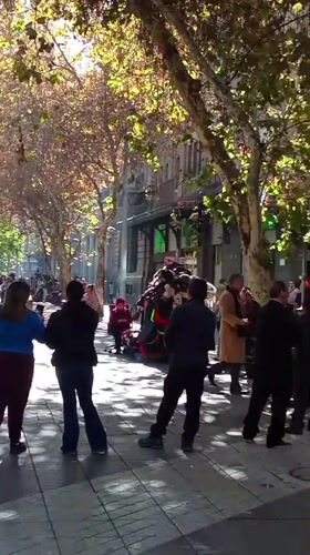 Street gathering with colorful items observed in Santiago