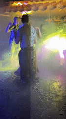 Rain-soaked outdoor dance party captured in Vietnam's Phu Thuy Ward