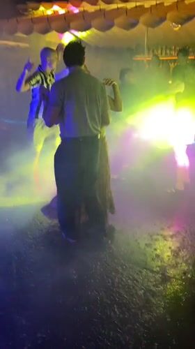 Rain-soaked outdoor dance party captured in Vietnam's Phu Thuy Ward