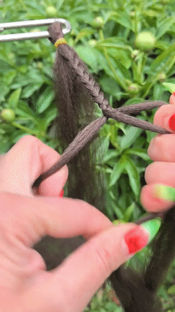 Person with watermelon nail art braids hair in Russia