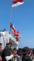 Bamboo pole event draws a crowd on a sunny Bali beach