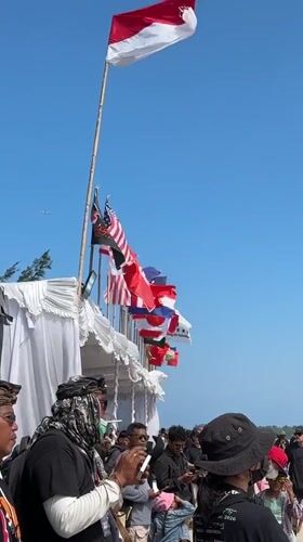 Bamboo pole event draws a crowd on a sunny Bali beach