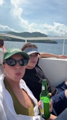 Tourists enjoy sunny boat trip near Indonesian island