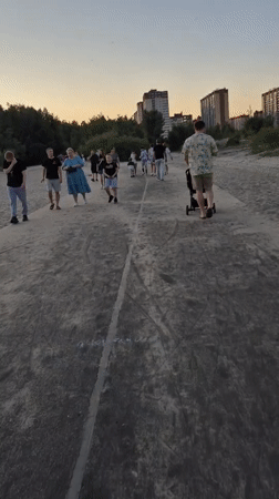 Evening leisure activities observed around Voronezh waterfront during sunset
