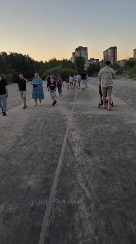 Evening leisure activities observed around Voronezh waterfront during sunset