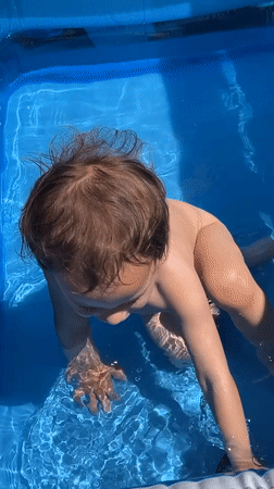 Morning domestic scenes: toddler pool play, breakfast documentation