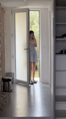 Woman takes selfie in doorway in Ivanovići, Montenegro