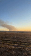 Smoke plume and sunset moment captured in Лобаново, Russia