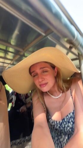 Tourist takes selfie during bumpy ride in Karon, Thailand