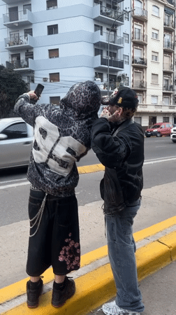 Two young men spotted on Buenos Aires sidewalk