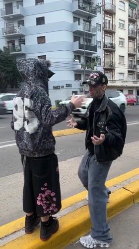 Two young men spotted on Buenos Aires sidewalk
