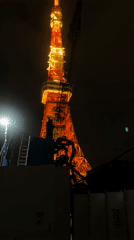 Tokyo Tower construction continues amid rainy morning in Minato