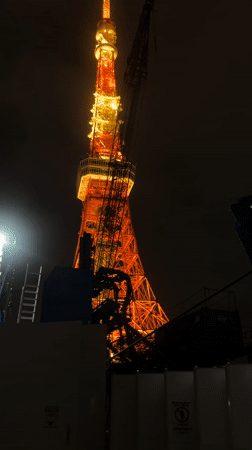 Tokyo Tower construction continues amid rainy morning in Minato