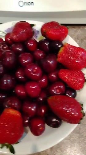 Fresh cherries and strawberries served in Yekaterinburg kitchen