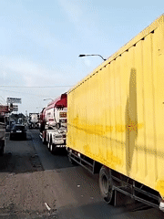 Commercial trucks observed on street in Kebakkramat, Indonesia