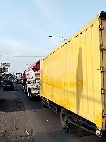 Commercial trucks observed on street in Kebakkramat, Indonesia