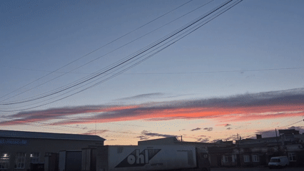 Sunset clouds and swan sculpture observed in brief sequence