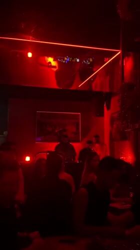 Nightclub scene captured in Dubai with red lighting